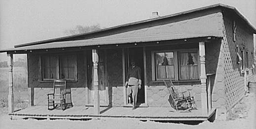 Faded photograph of a migrant potato-picker boarding at a house in Freehold, NJ in 1938