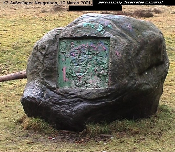 photo of persistently desecrated memorial stone in Neugraben kz site